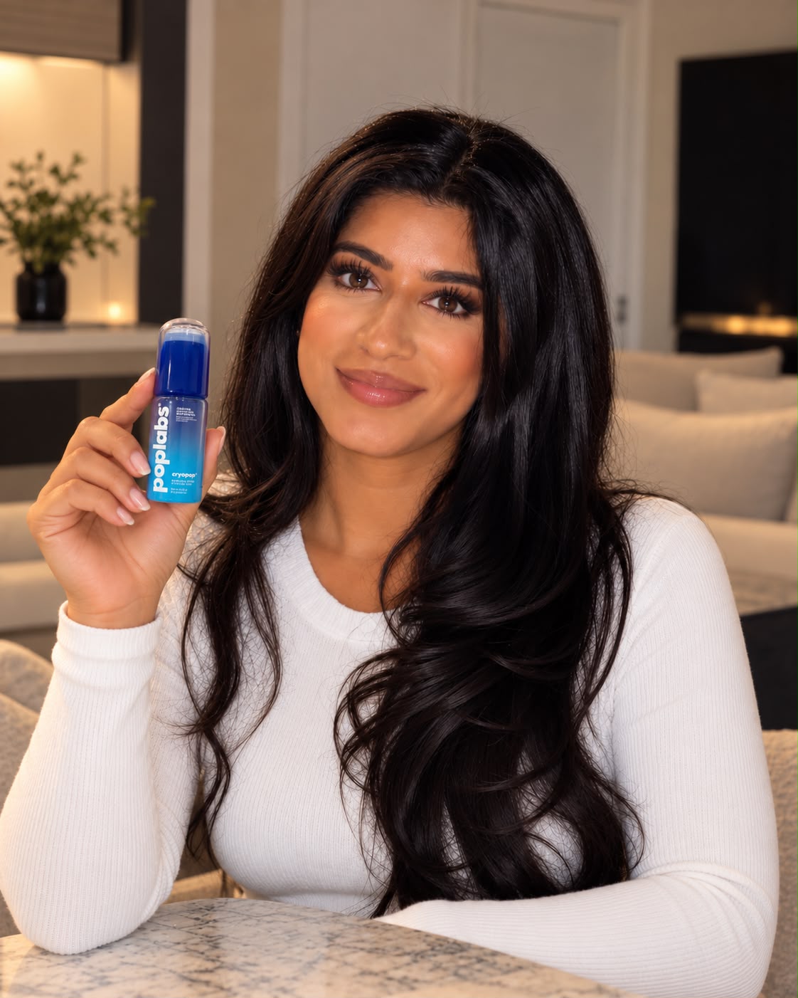 Sidra, founder of poplabs, holding CRYOPOP