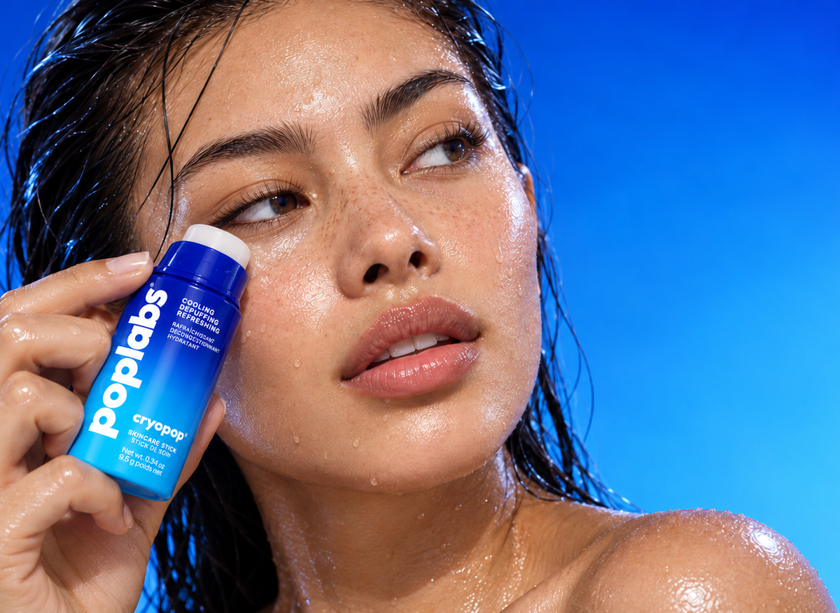 Woman applying the CRYOPOP cooling stick under her eye